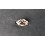 Gemporia - An 18ct gold csarite and diamond ring,