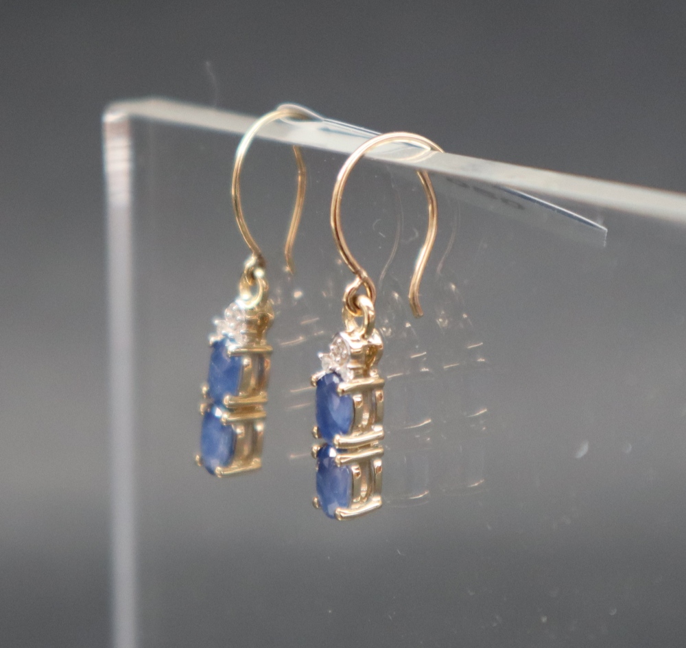 Gemporia - A pair of 9ct gold blue sapphire and diamond earrings, - Image 3 of 6