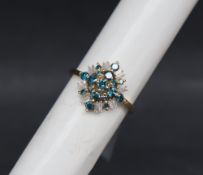 Gemporia - A 9ct gold blue and white diamond ring,