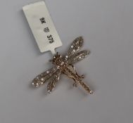 Gemporia - A 9ct gold champagne and white diamond dragonfly pendant,