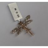 Gemporia - A 9ct gold champagne and white diamond dragonfly pendant,