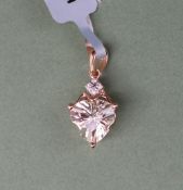 Gemporia - A 9ct gold serenite and diamond pendant,