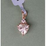 Gemporia - A 9ct gold serenite and diamond pendant,