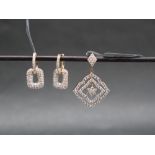 Gemporia - A 9ct gold Tomas Rae diamond pendant, set with round cut diamonds totalling 1ct,