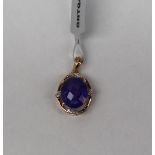 Gemporia - A 9ct gold tanzanite and diamond pendant, set with oval tanzanite and round diamond,