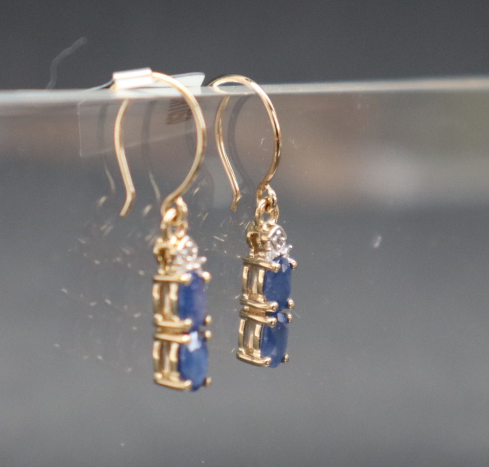 Gemporia - A pair of 9ct gold blue sapphire and diamond earrings, - Image 2 of 6