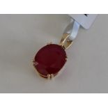 Gemporia - A 9ct gold ruby pendant, set with oval cut Malagasy ruby,