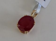 Gemporia - A 9ct gold ruby pendant, set with oval cut Malagasy ruby,