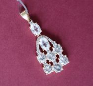 Gemporia - A 9ct gold zircon and white sapphire pendant,