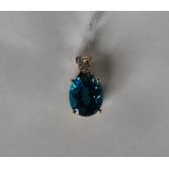 Gemporia - A 9ct gold blue topaz and diamond pendant, set with oval blue topaz and round diamonds,