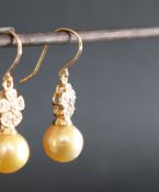 Gemporia - A pair of 9ct gold cultured pearl and white zircon earrings,