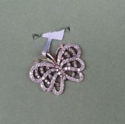 Gemporia - A 9ct gold diamond butterfly pendant, set with round cut diamonds totalling 1.