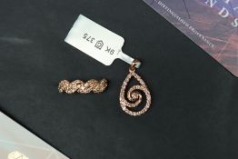 Gemporia - A 9ct rose gold pendant, set with thirty-four diamonds totalling 0.