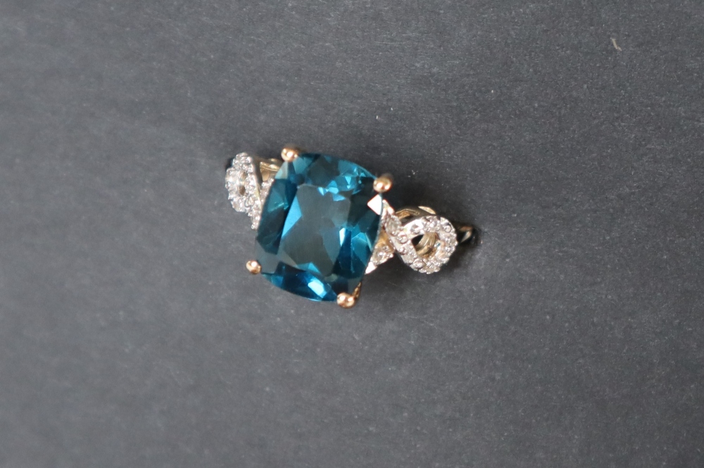 Gemporia - A 9ct blue topaz and white zircon ring,