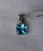 Gemporia - A 9ct gold blue topaz and white zircon pendant,