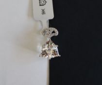 Gemporia - A 9ct white gold crystal quartz and white zircon pendant,