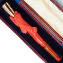 19th CENTURY CORAL AND GOLD CIGARETTE HOLDER