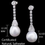 MAGNIFICENT PAIR OF NATURAL SALTWATER PEARL AND DIAMOND EARRINGS, Good to very good lustre.