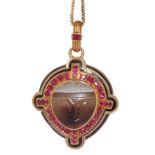 ANTIQUE RUBY, ENAMEL AND CARVED FACE LOCKET PENDANT