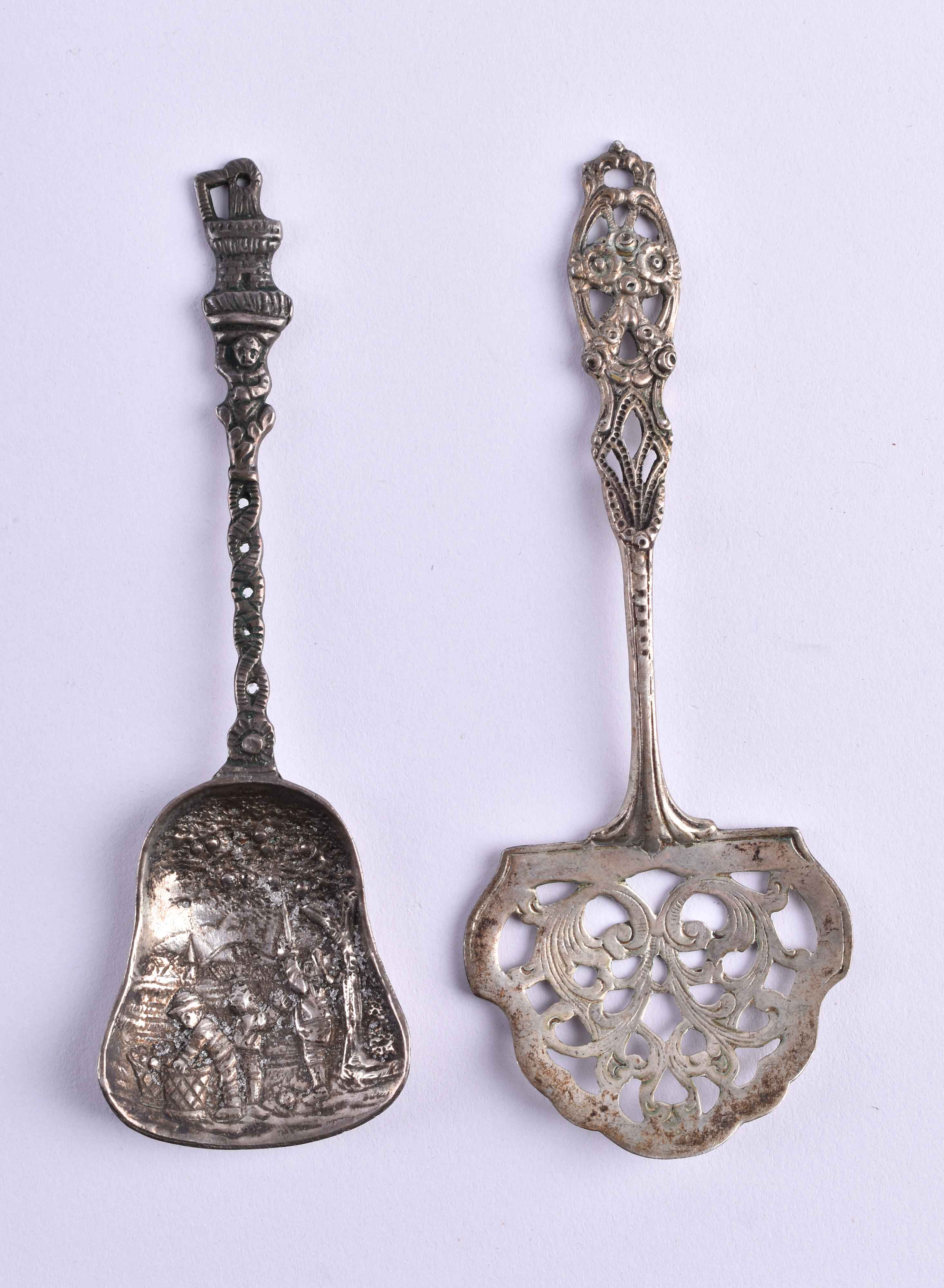 two sugar scoops around 1900