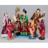 7 asiatische Puppen