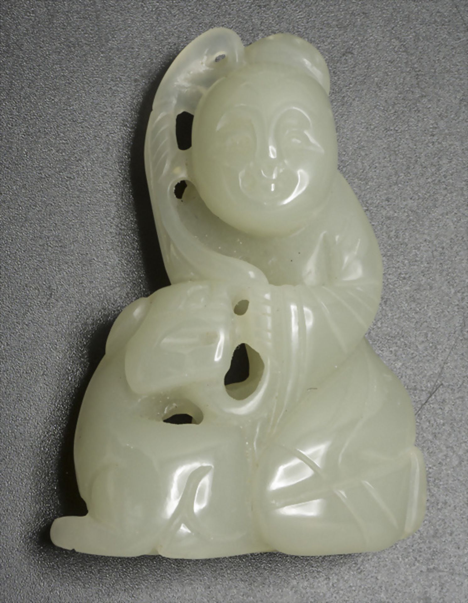 Jadefigur 'Bodhisattva mit Löwe' / A jade Bodhisattva figure with lion