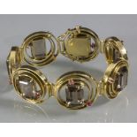 Armband mit Rauchtopas und Rubinen / A 18ct gold bracelet with topas and rubies