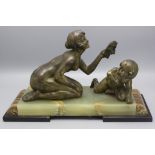 George Maxim (1885-1940), Bronzeskulptur 'Kniendes Mädchen mit Maske und Faunkind', ...