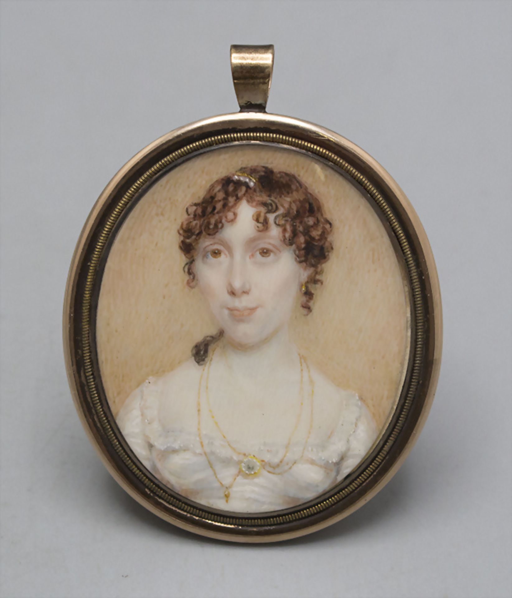 Miniatur einer Dame / A miniature portrait of a lady in an 8ct gold frame, 19. Jh.