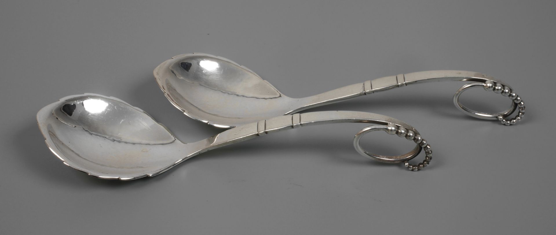 Georg Jensen zwei Vorlegelöffel Silber