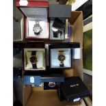 Seven glamorous designer watches mostly unused and in original boxes including Klaus-Kobek,