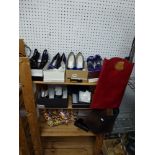 An interesting collection of fashion items which includes dress shoes in satin and suede,