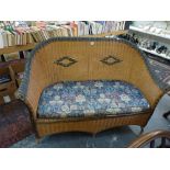 A cane conservatory settee with coloured decoration. WE DO NOT TAKE CREDIT CARDS OR CASH. STORAGE IS