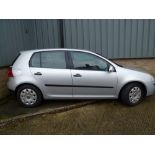 A Volkswagen Golf S five-door motor car in silver, 1390 cc, registration number SM05 KYK, with a