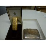 A Dunhill gold plated lighter in bark finish seemingly little used in its original box with