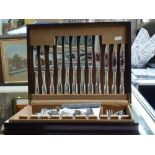 A dark wood canteen containing a handsome EPNS cutlery service by Guy Degrenne, in Fiddle pattern,