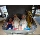 A suitcase containing a vintage mohair teddy bear with moving joints and growler, 22 in