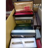 A set of new writing implements in original boxes including Cross and Sheaffer and two pairs of