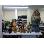 A large wooden carved and painted Egyptian model of a Mummy plus 24 further Egyptian figurines