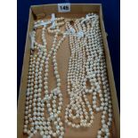 Five cultured pearl necklaces, comprising: a good three-strand example, with 9 ct yellow gold clasp,