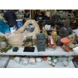 A good mixed lot including a large carved wooden swan, a wooden Buddha, a vintage pull-along duck