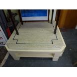 A smart modern coffee table of octagonal form with a travertine stone top with blue line inlay. WE