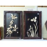 A good pair of Japanese Meiji period black lacquer and carved bone panels, with stems of lily and of