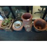 Eight circular and square terracotta pots, a terracotta chimney, further china planters, four