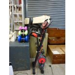 A Pleny folding exercise bike and a set of dumbbells in holder. [by garage doors] WE DO NOT TAKE