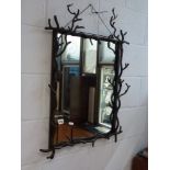 A heavy metal mirror with twisted branch frame. WE DO NOT TAKE CREDIT CARDS OR CASH. STORAGE IS