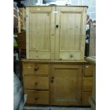 A Victorian pine kitchen unit the central cupboard flanked by six drawers, a Victorian pine cupboard