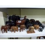 A collection of ebony and other elephants including a pair of ebony elephant bookends [s71] WE DO