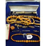 A vintage butterscotch amber necklace, of graduated oval beads, with 9 ct bolt ring; together with
