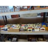 An extensive collection of boxed and unused commemorative and historic motor vehicles including Coca